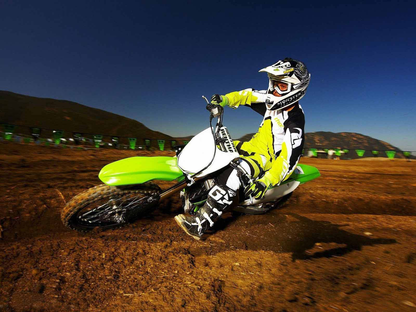 A Person Riding A Dirt Bike Background