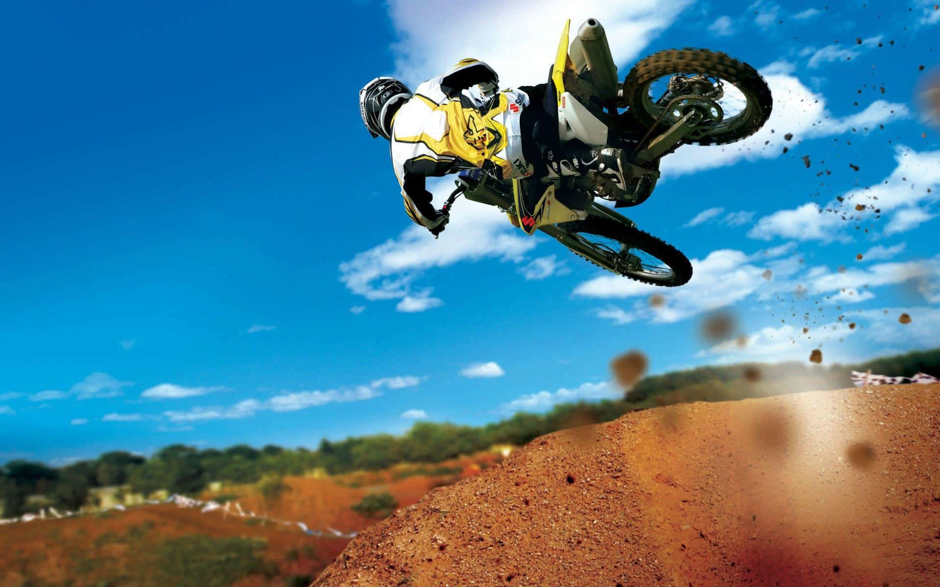 A Person Riding A Dirt Bike Background