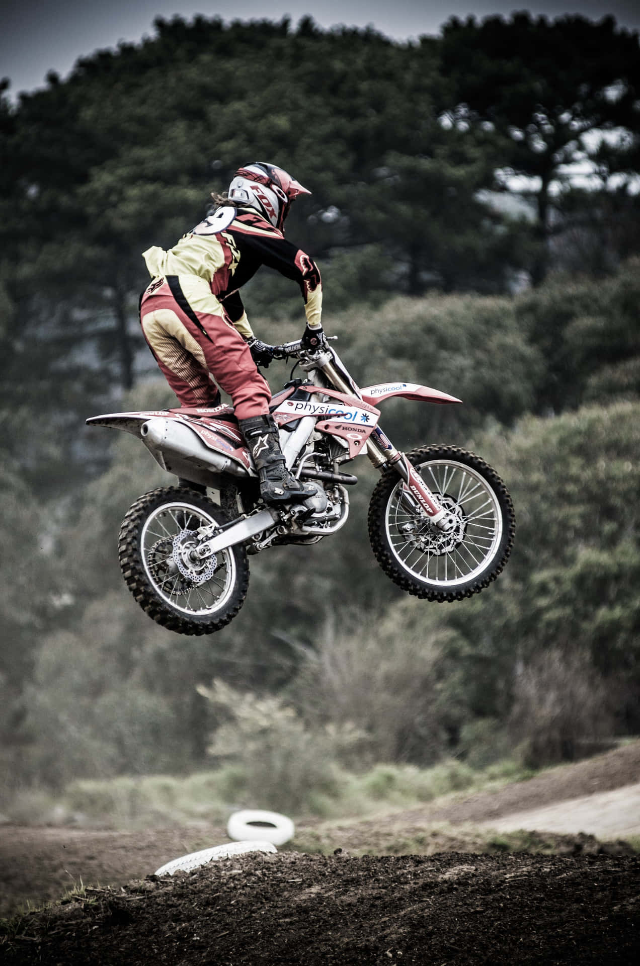 A Person Riding A Dirt Bike Background