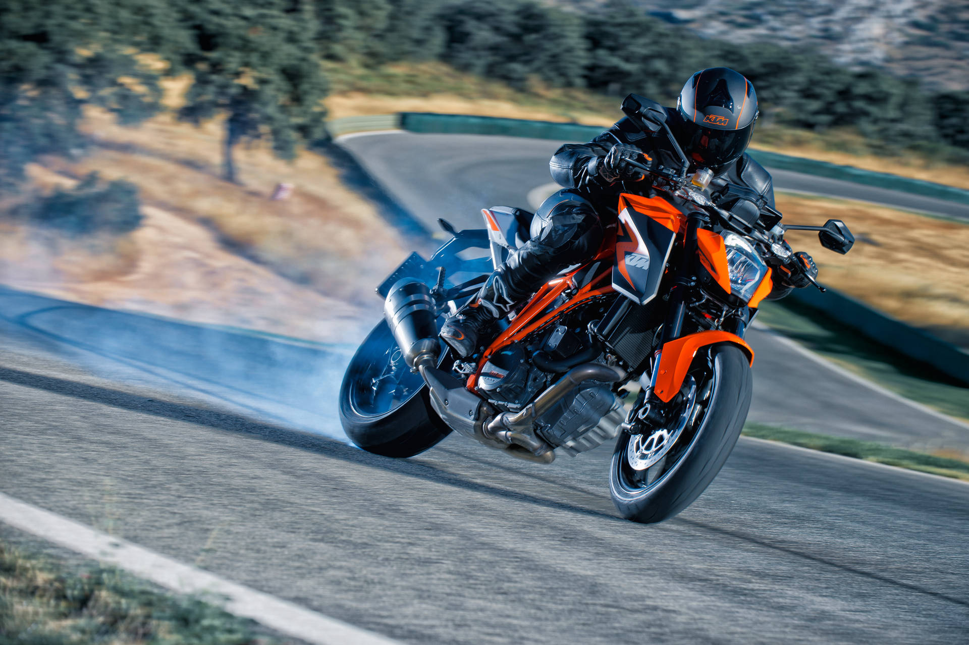 A Person Riding A Ktm Duke 200 Background