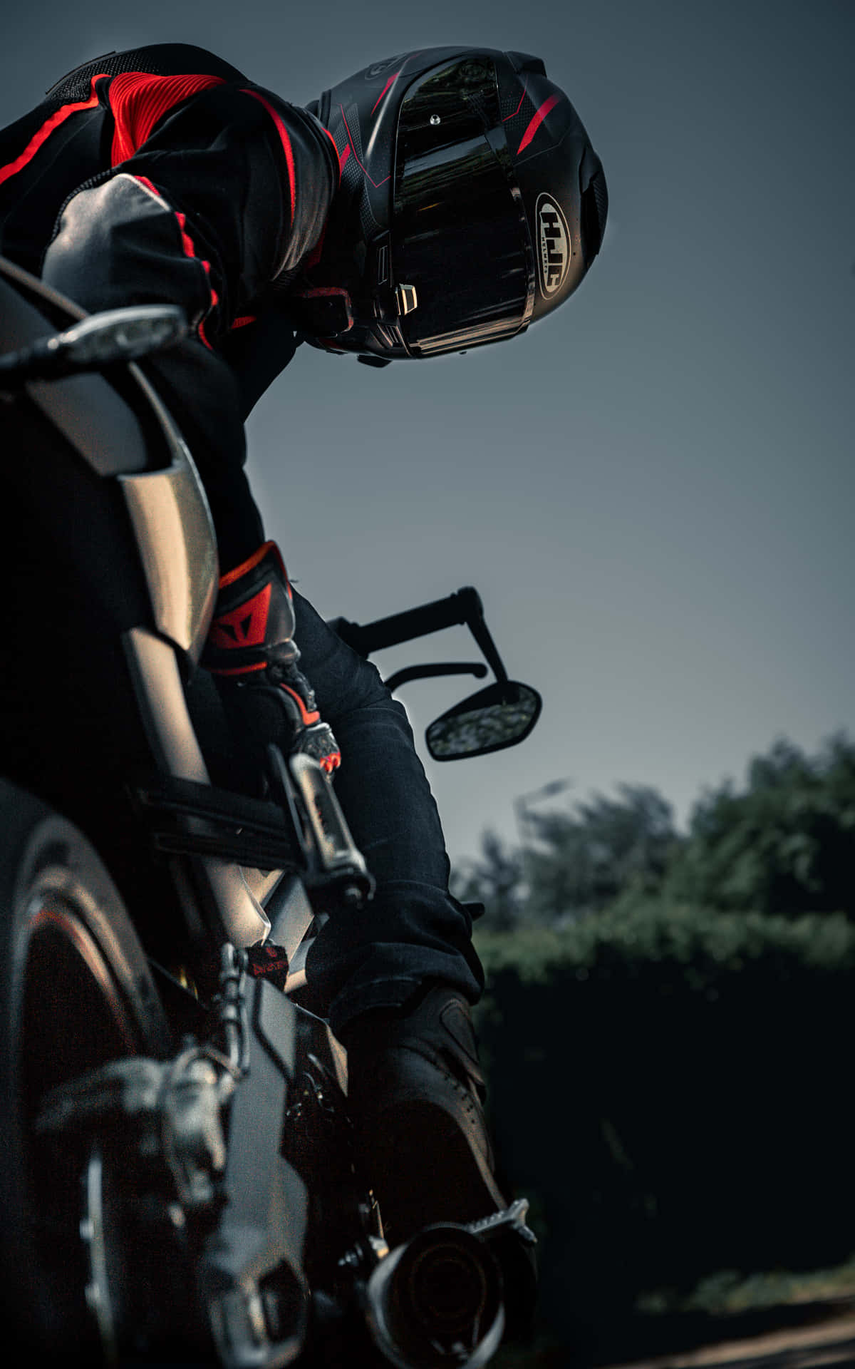 A Person Riding A Motorcycle Background