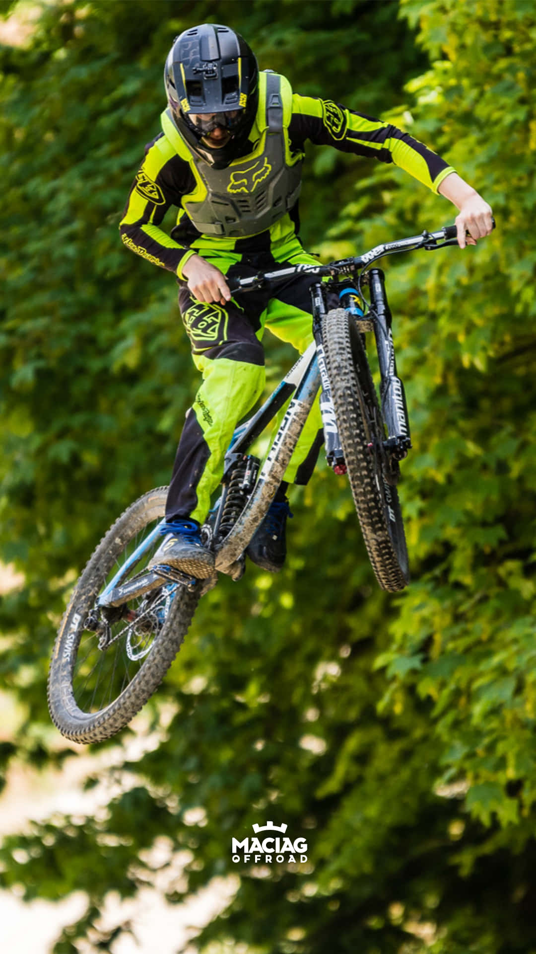 A Person Riding A Mountain Bike In The Air