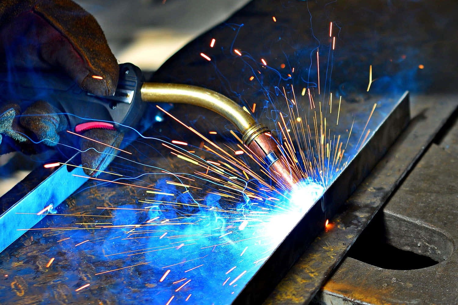 A Person Welding Metal Background