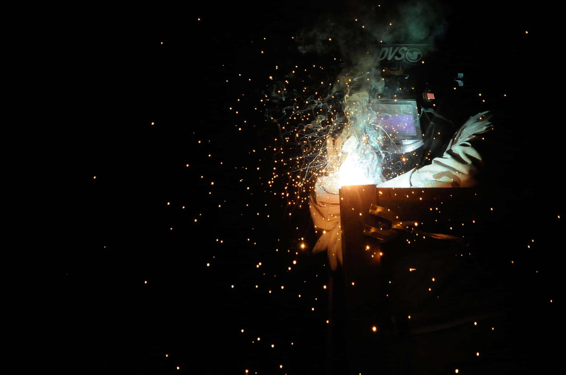 A Person Welding Background