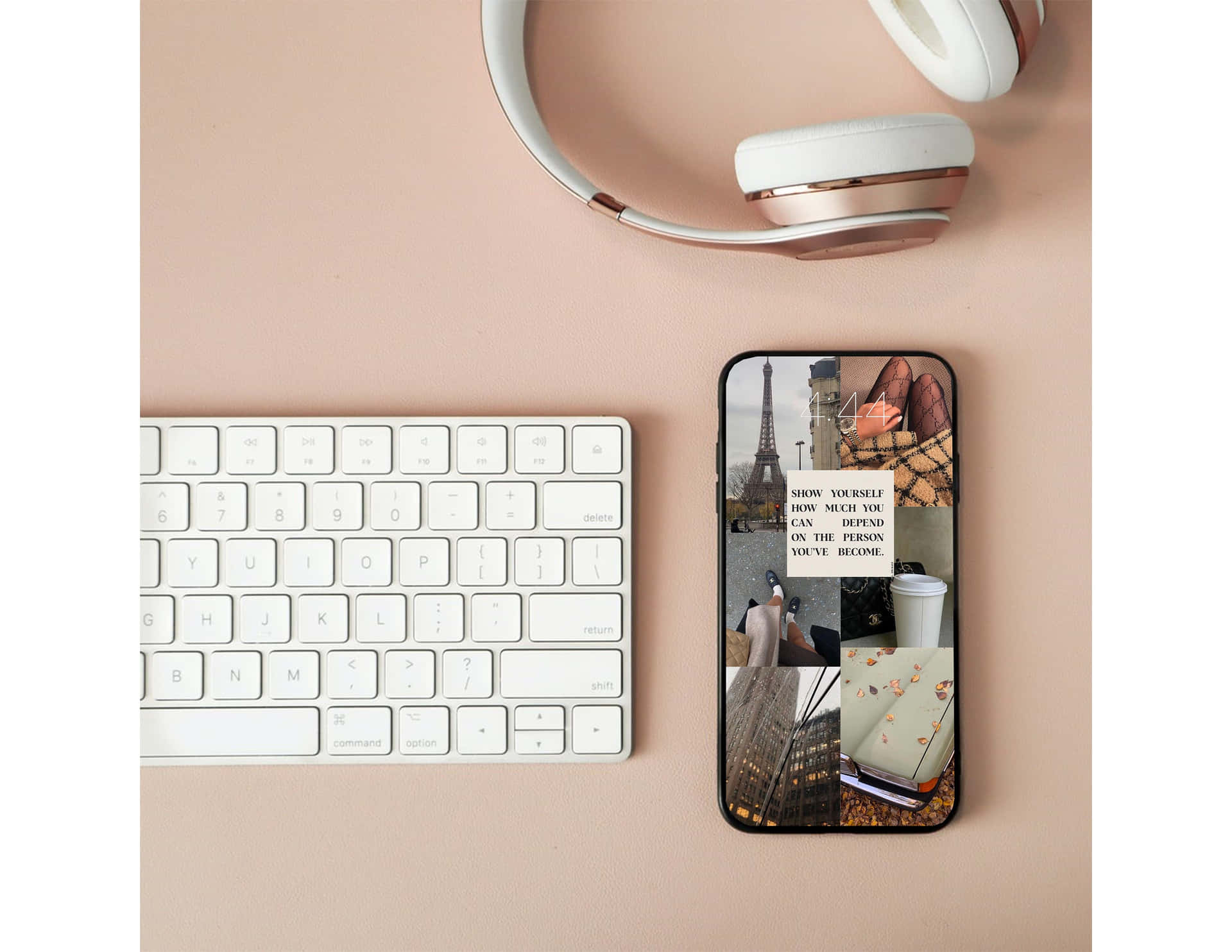 A Phone, Keyboard And Headphones On A Desk Background