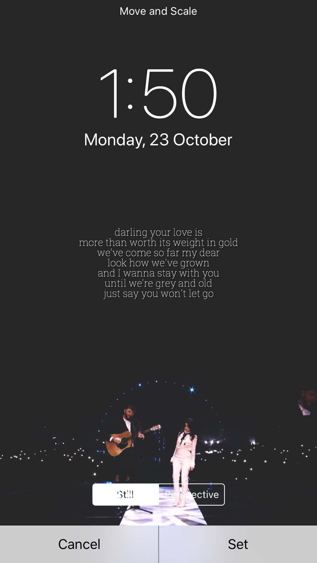 A Phone Screen Showing A Concert And A Clock Background