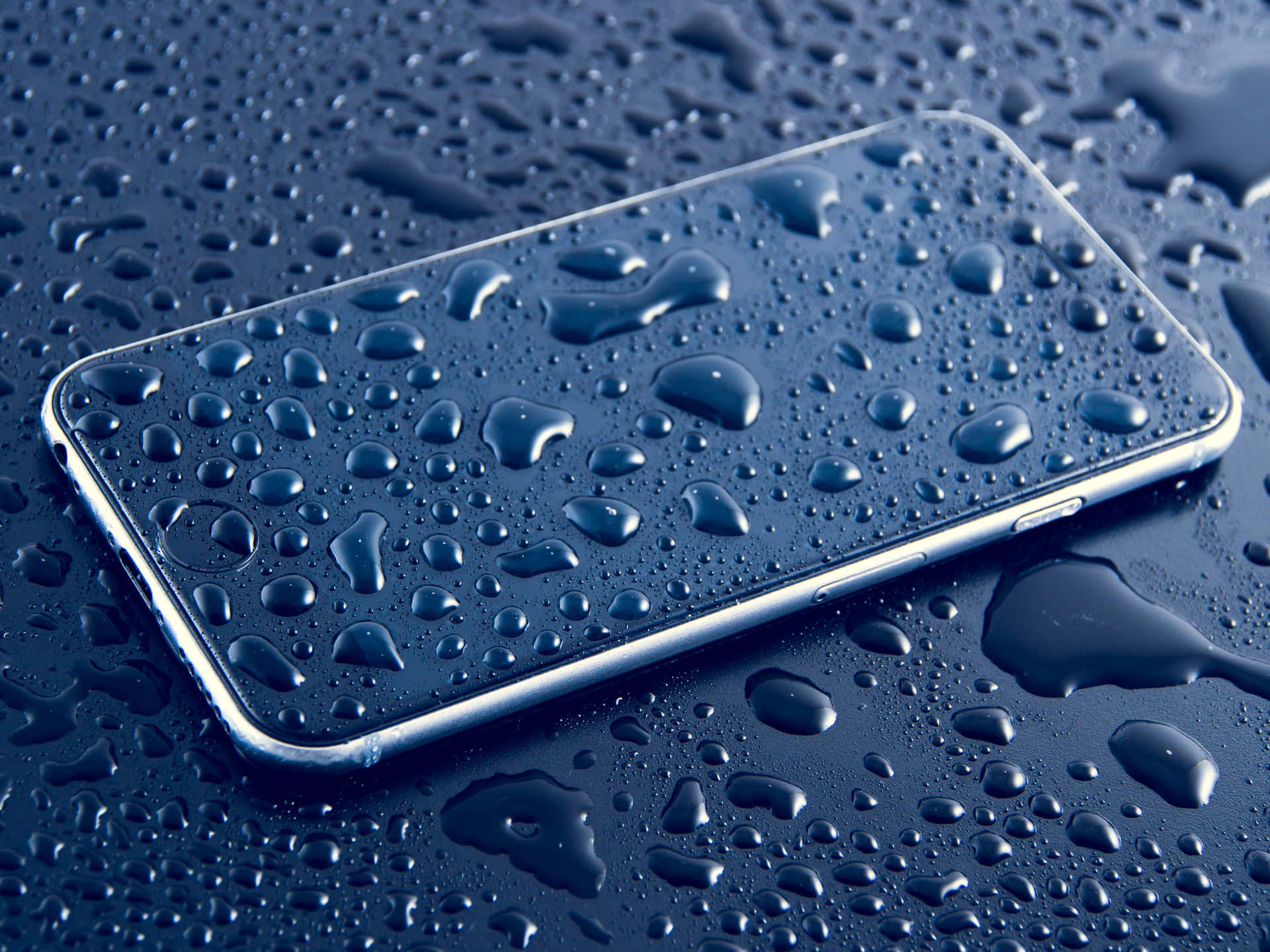 A Phone With Water Drops On It