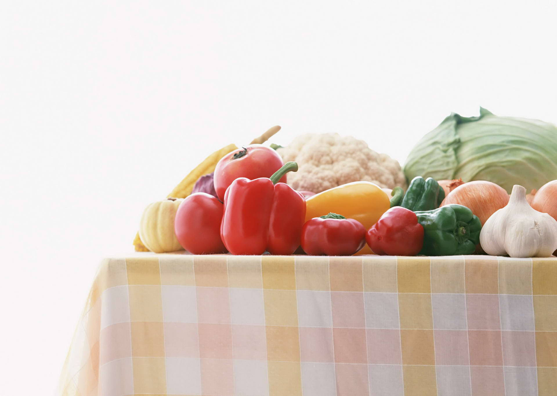 A Picnic Table Overflowing With Fresh Vegetables Background