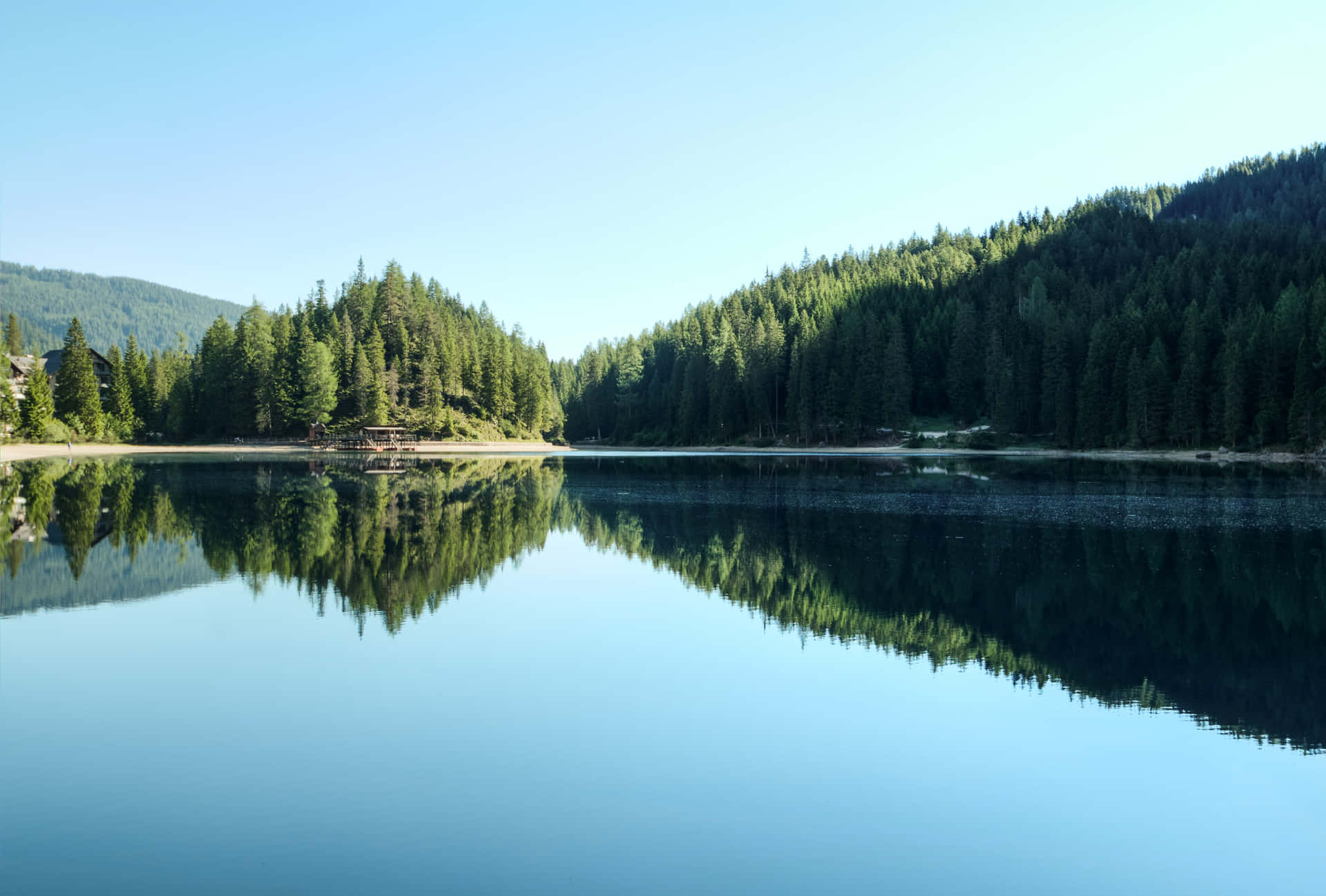 A Picture-perfect View Of A Snow-capped Mountain Lake Background