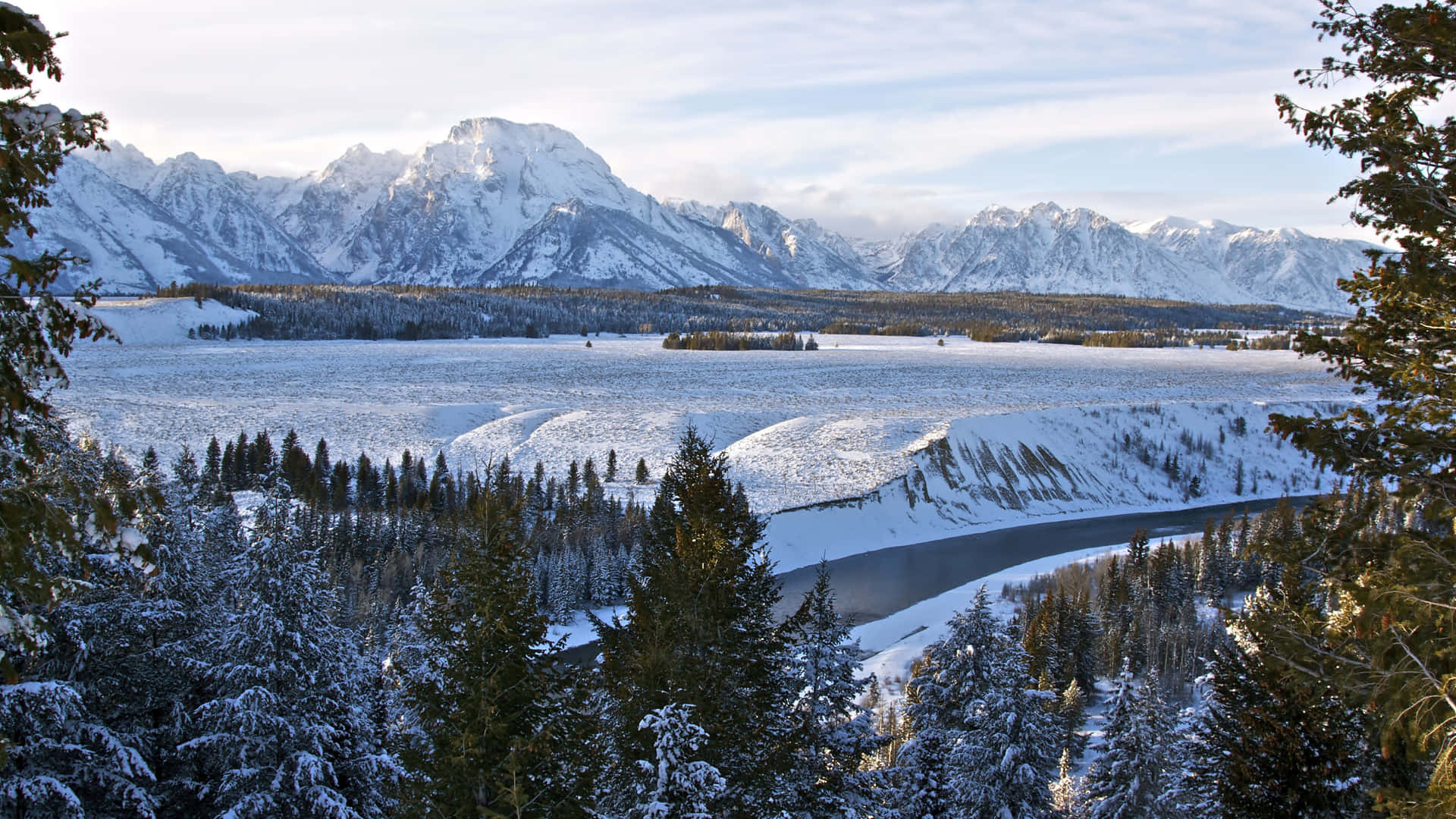 A Picturesque Landscape Of A Wintery Landscape With Snow-covered Mountains Background