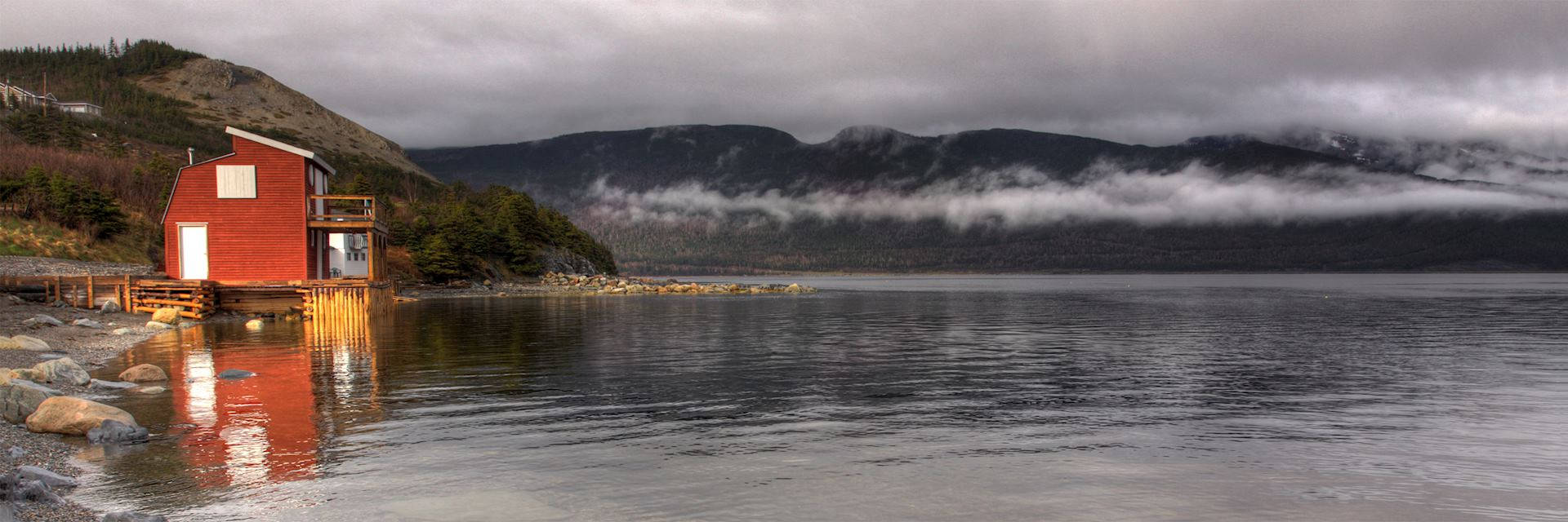 A Picturesque Shoreside In Newfoundland Background