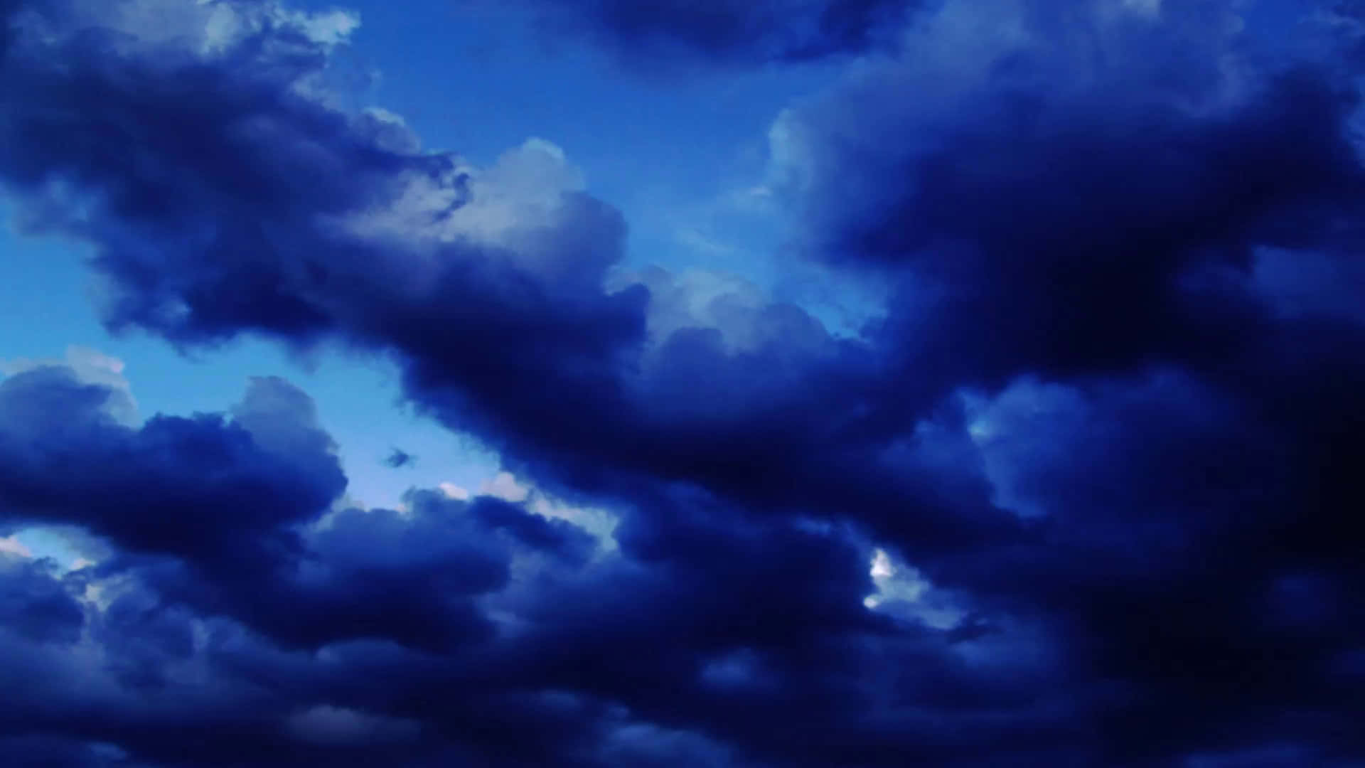 A Picturesque View Of A Cloudy Sky At Sunset Background