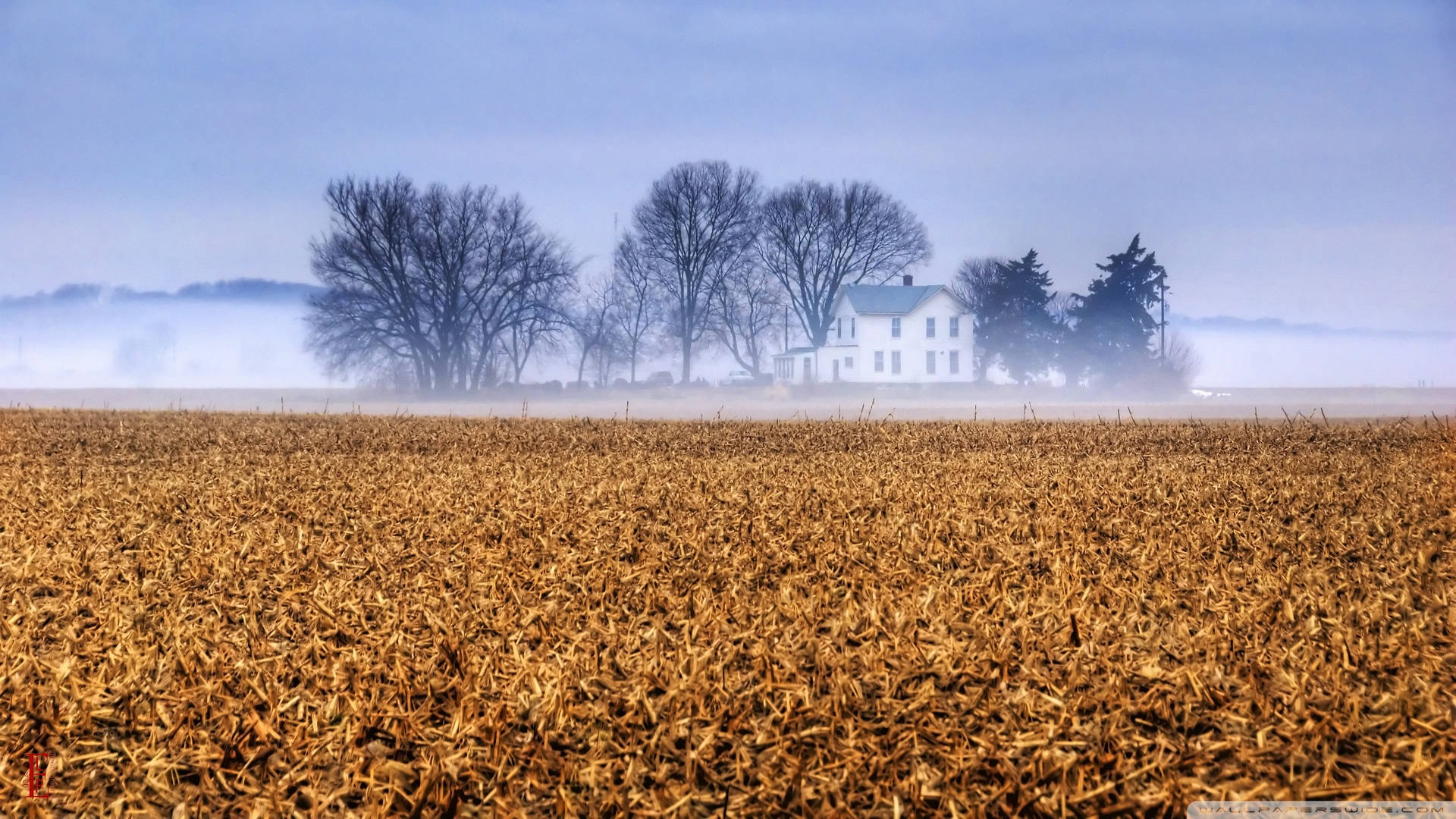 A Picturesque View Of A Farmhouse In The Rolling Hills Of Kansas Background