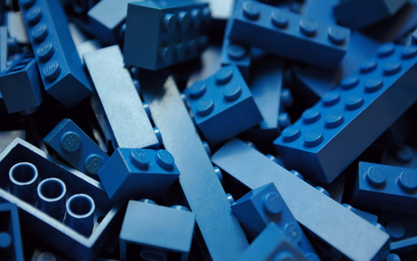 A Pile Of Blue Lego Blocks Background