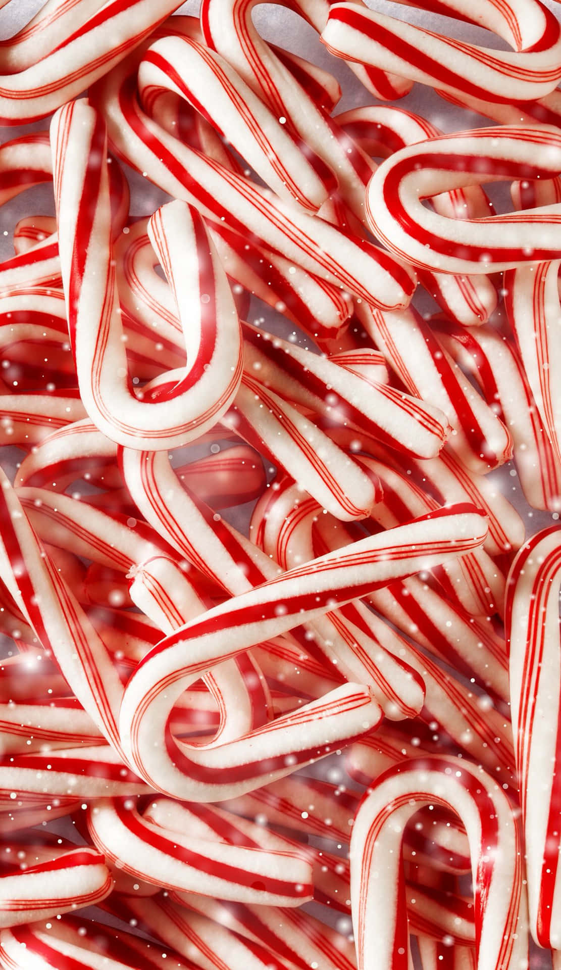 A Pile Of Candy Canes With A White Background Background