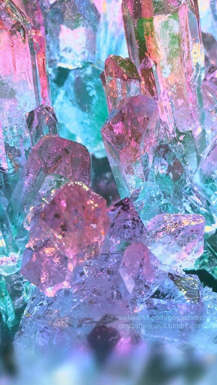 A Pile Of Crystals With Pink And Blue Colors