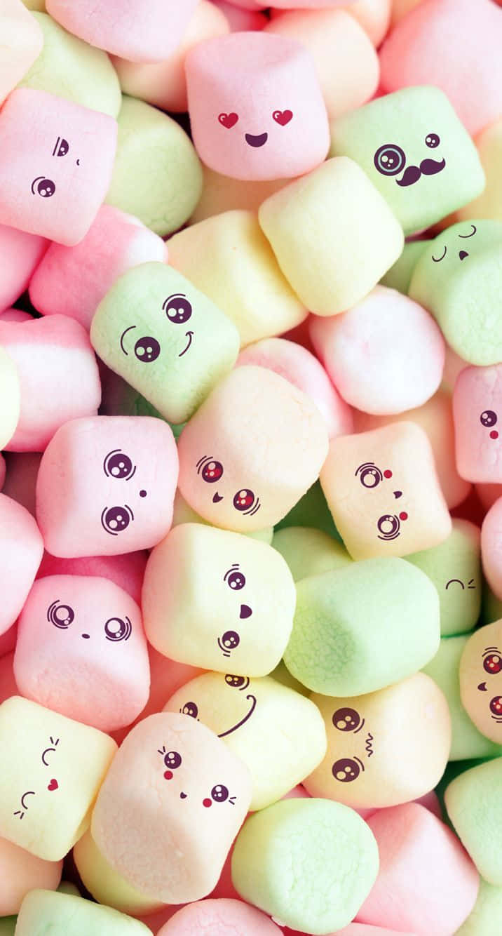 A Pile Of Marshmallows With Faces Drawn On Them