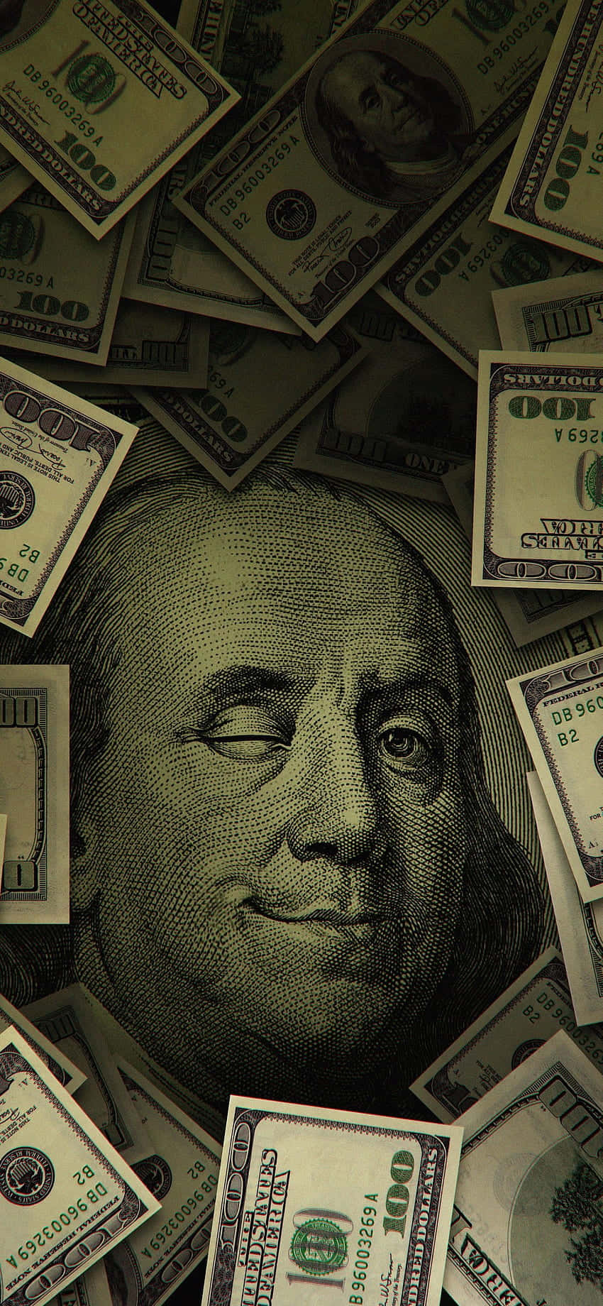 A Pile Of Money With A Dollar Bill In The Middle Background