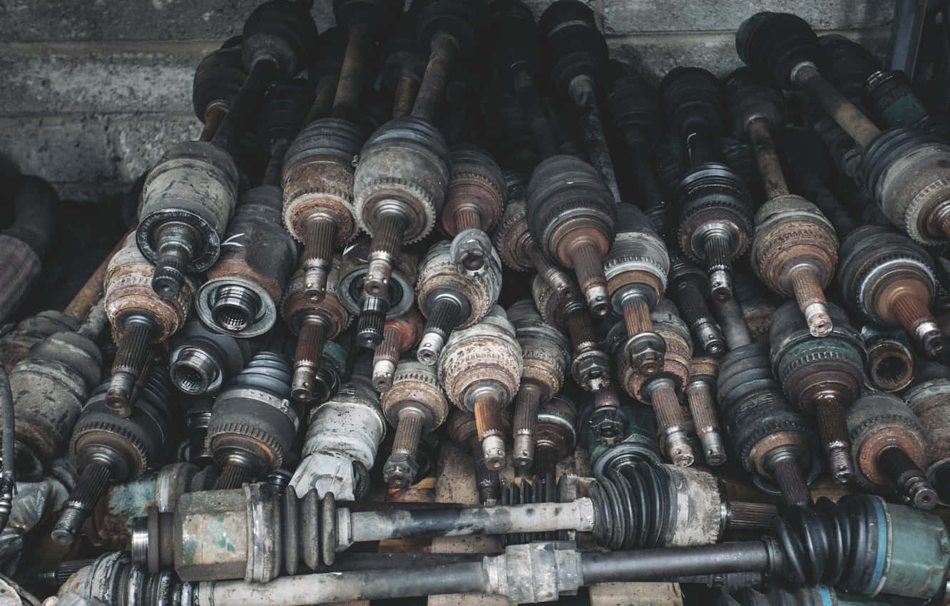 A Pile Of Old Parts In A Garage Background