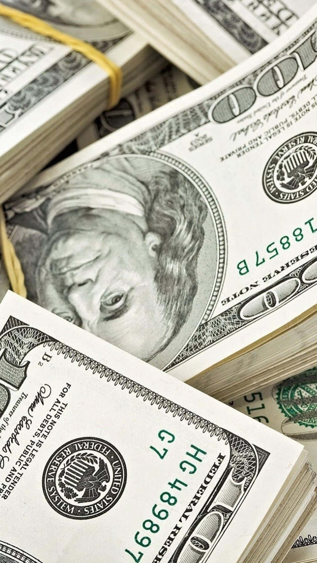 A Pile Of Us Dollar Bills With A Face On Them Background