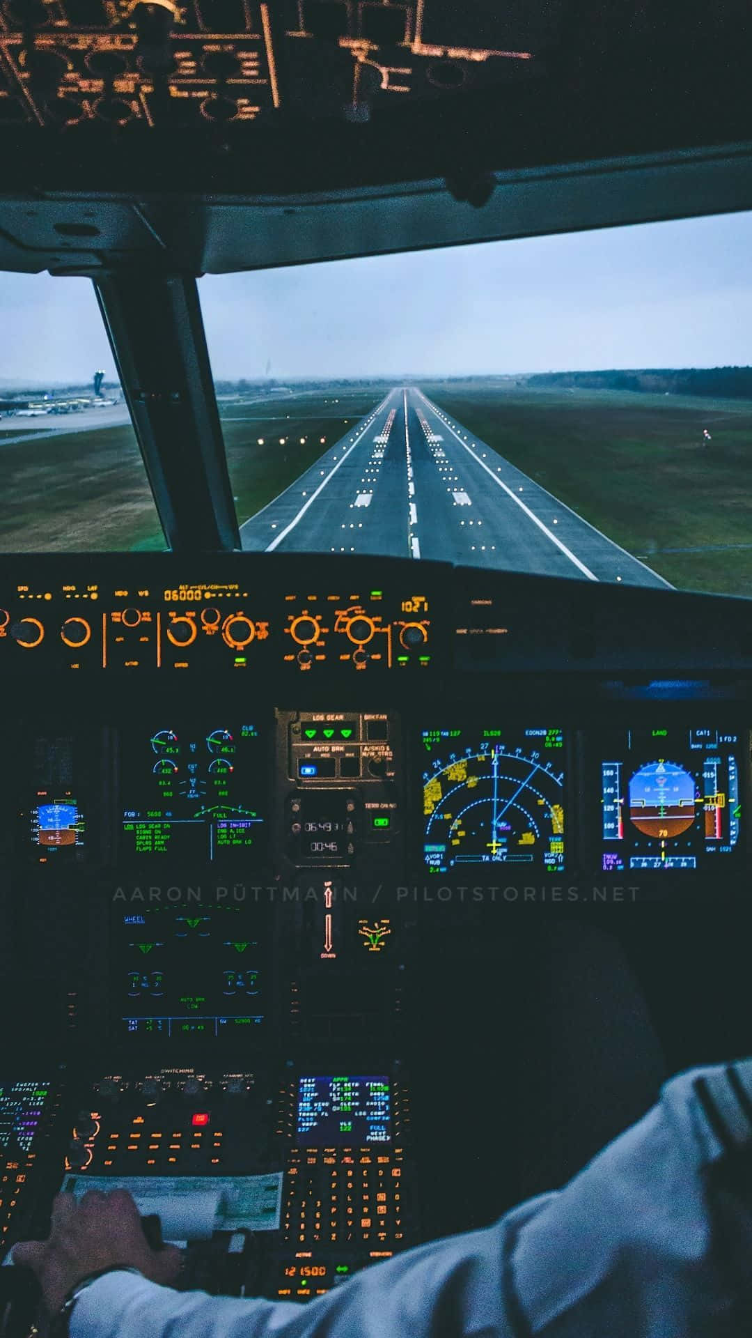 A Pilot Is Sitting In The Cockpit Of An Airplane Background