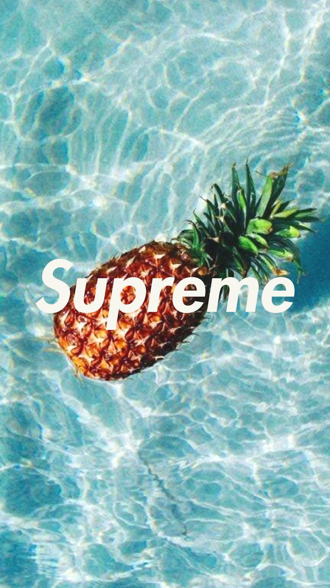 A Pineapple In The Water With The Word Supreme Background