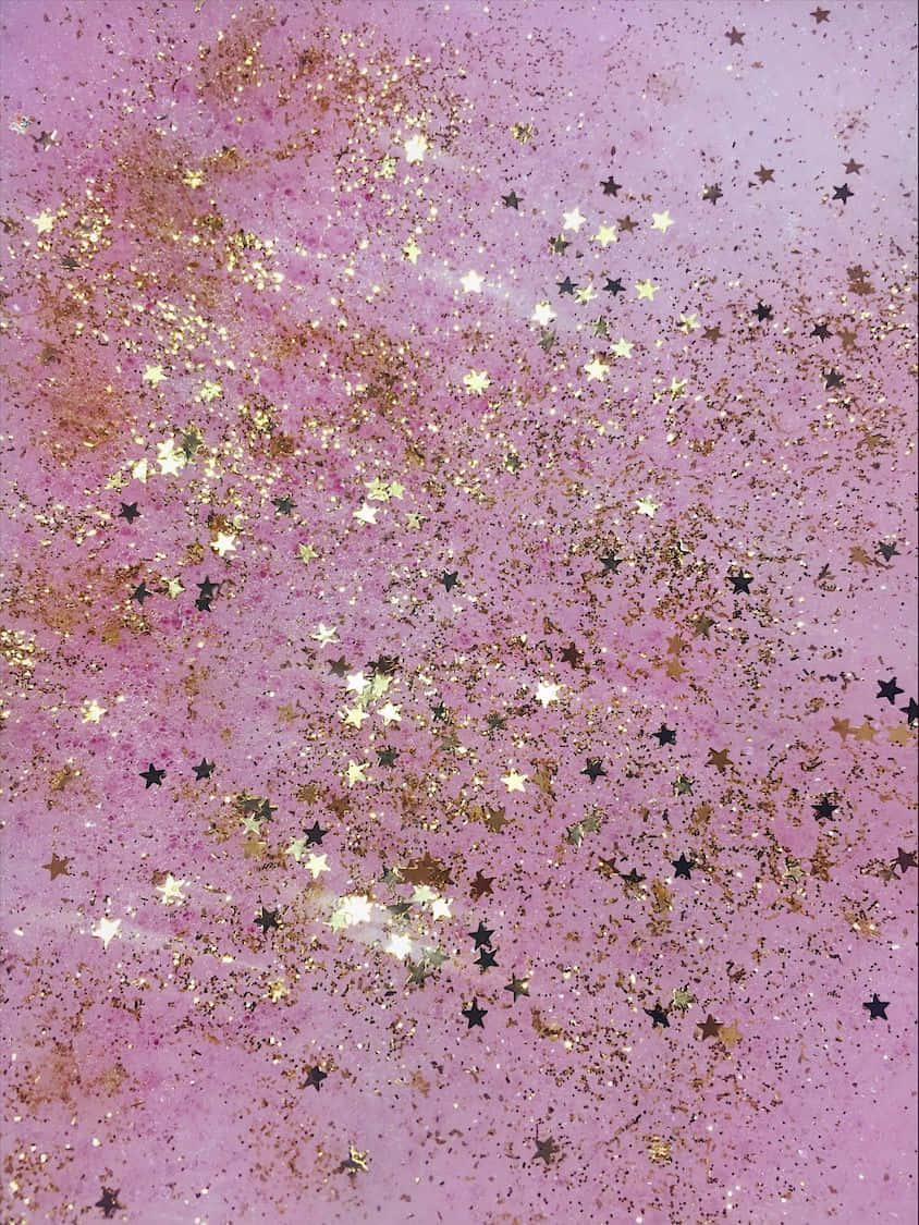 A Pink And Gold Glittery Painting With Stars Background