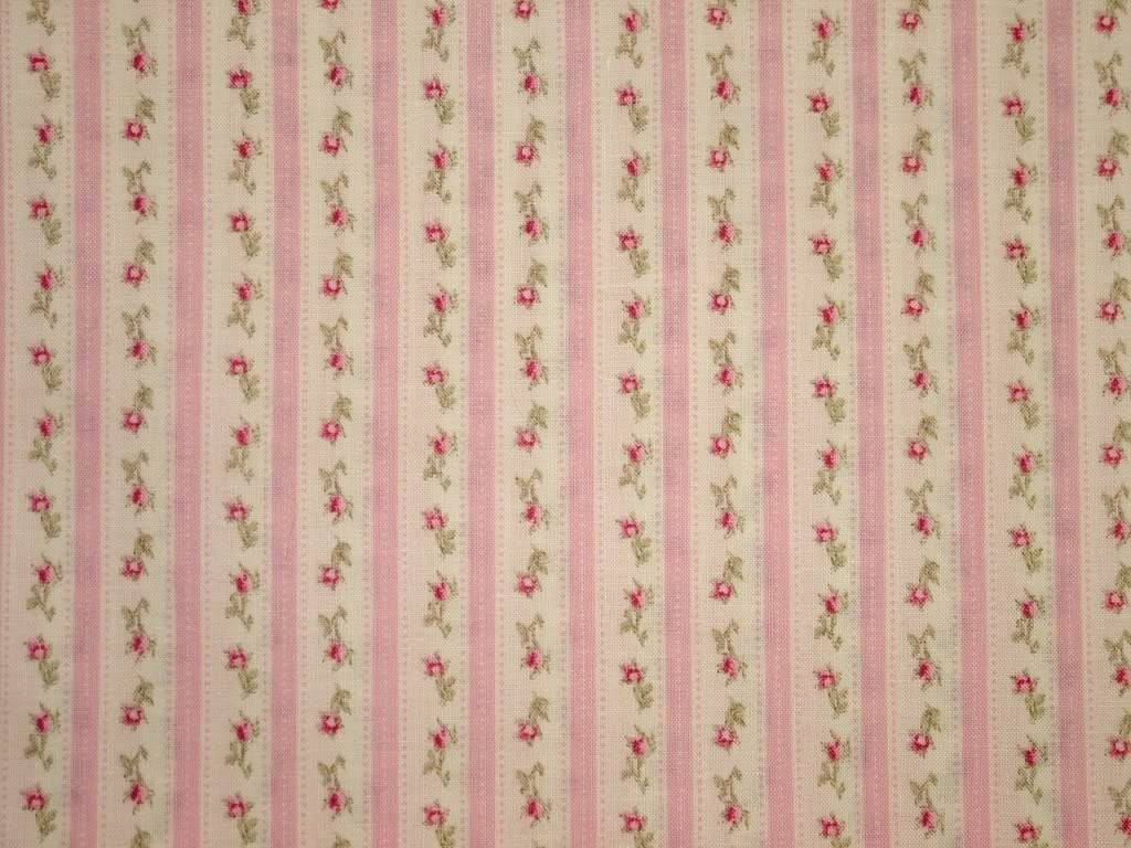 A Pink And Green Stripe Fabric With Roses