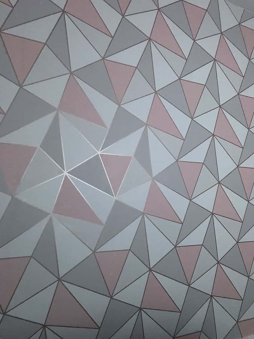 A Pink And Grey Geometric Wall With A White Border Background