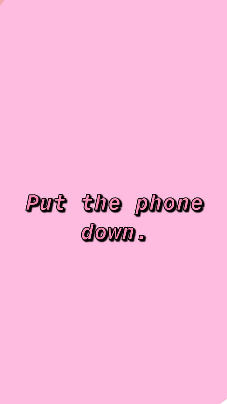 A Pink Background With The Words Put The Phone Down Background