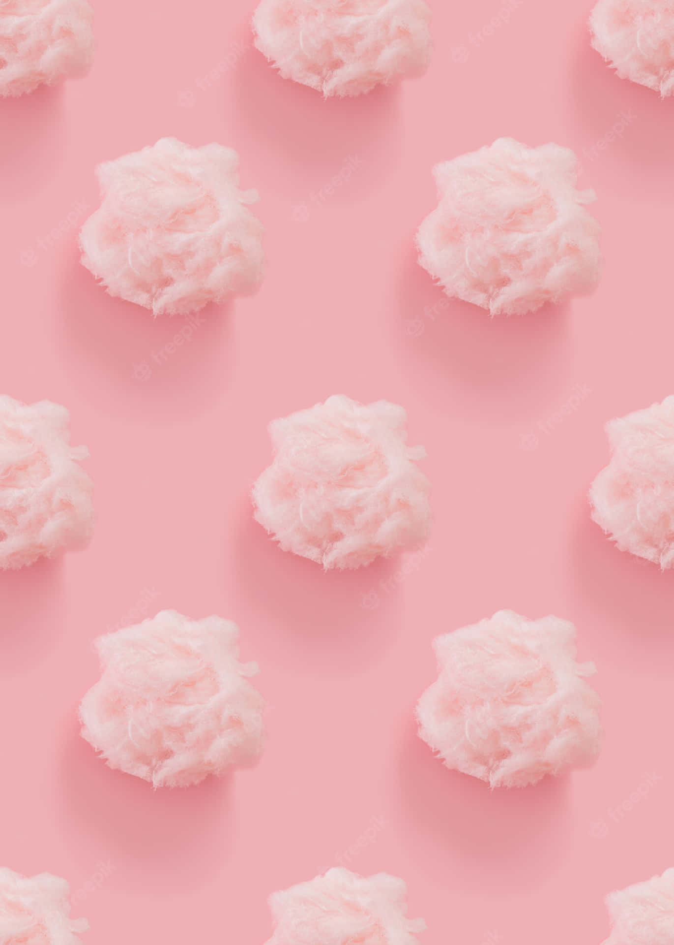 A Pink Background With White Clouds On It