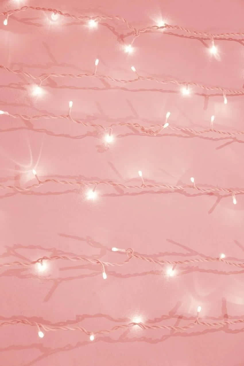 A Pink Background With White String Lights Background