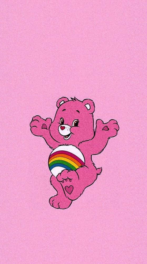 A Pink Bear With A Rainbow Ball In His Arms Background