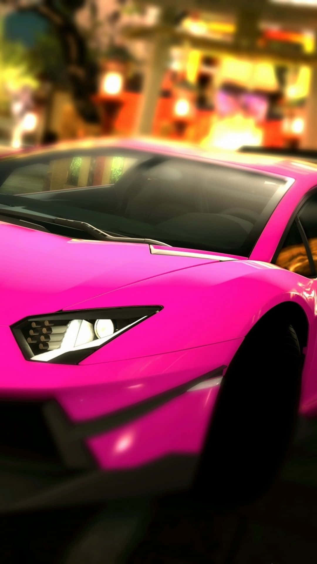 A Pink Car Driving Down The Street Background