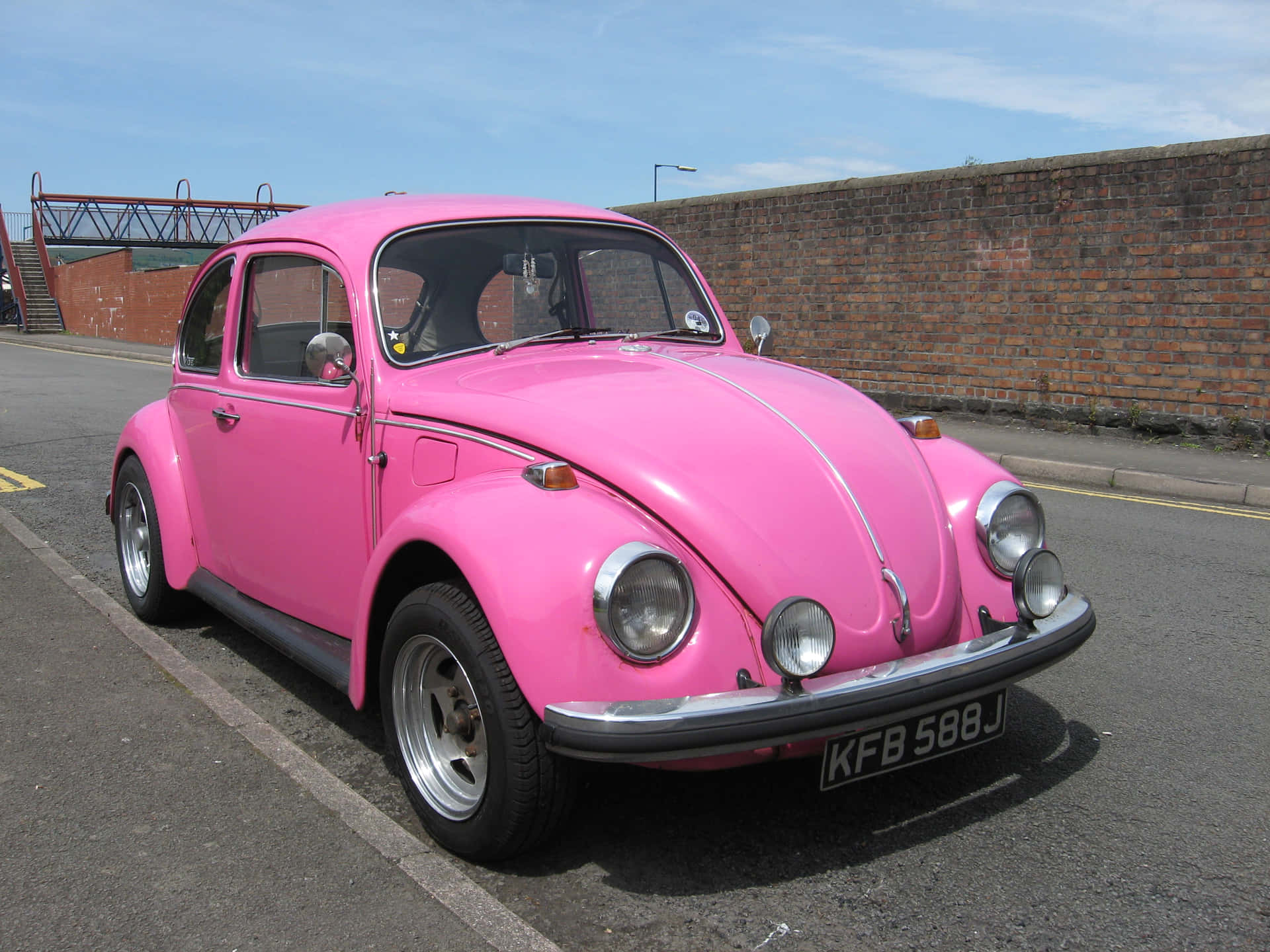 A Pink Car Parked On The Street Background