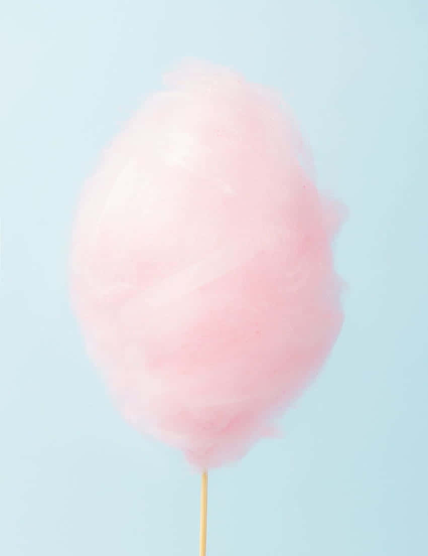 A Pink Cotton Candy On A Stick Background