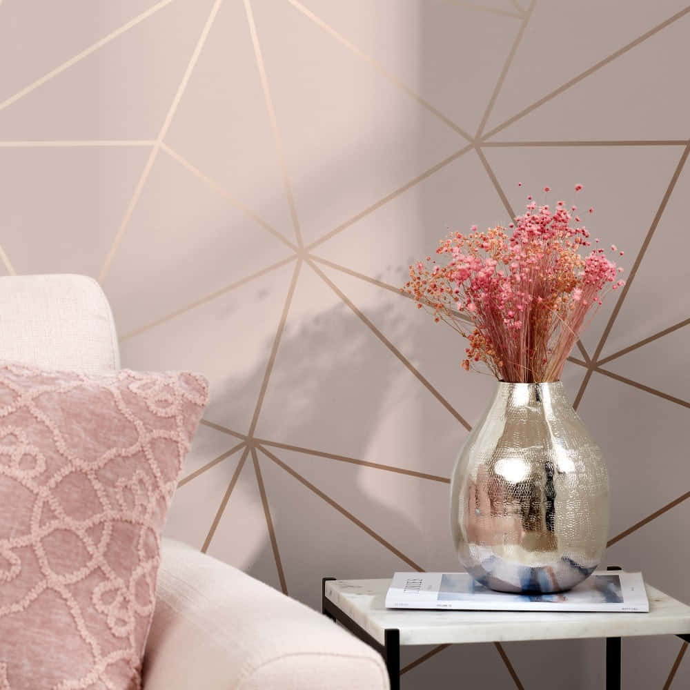 A Pink Couch And Pink Pillows Are In Front Of A Geometric Wallpaper Background