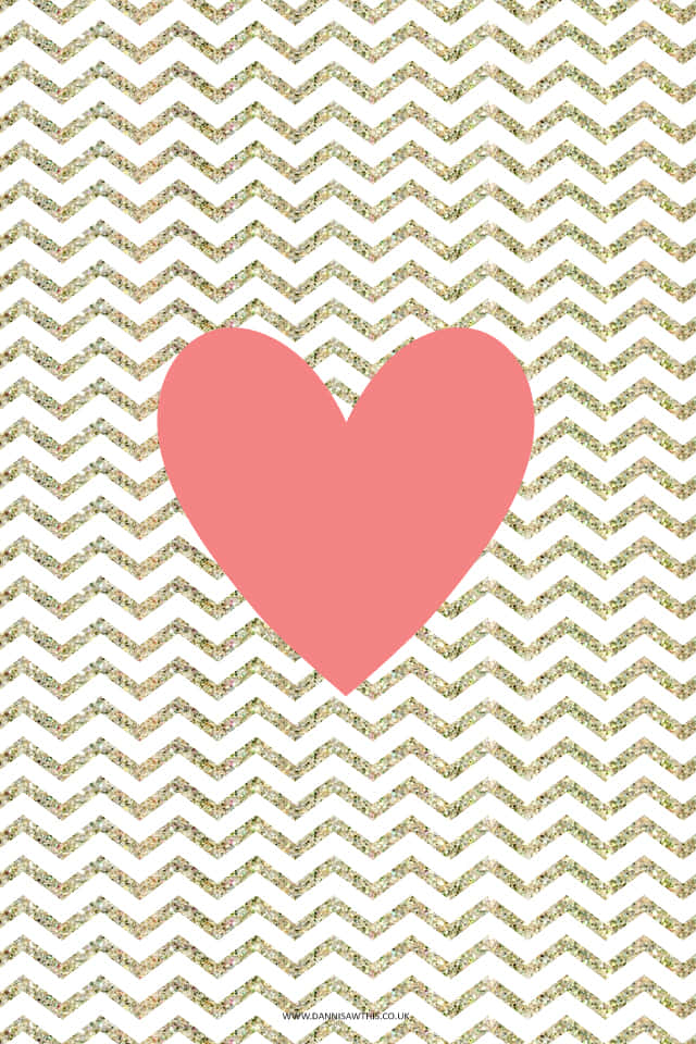 A Pink Heart On A Gold Chevron Background