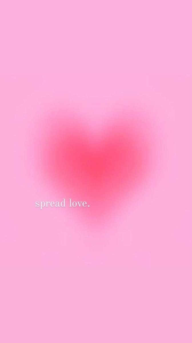 A Pink Heart With The Words Spread Love