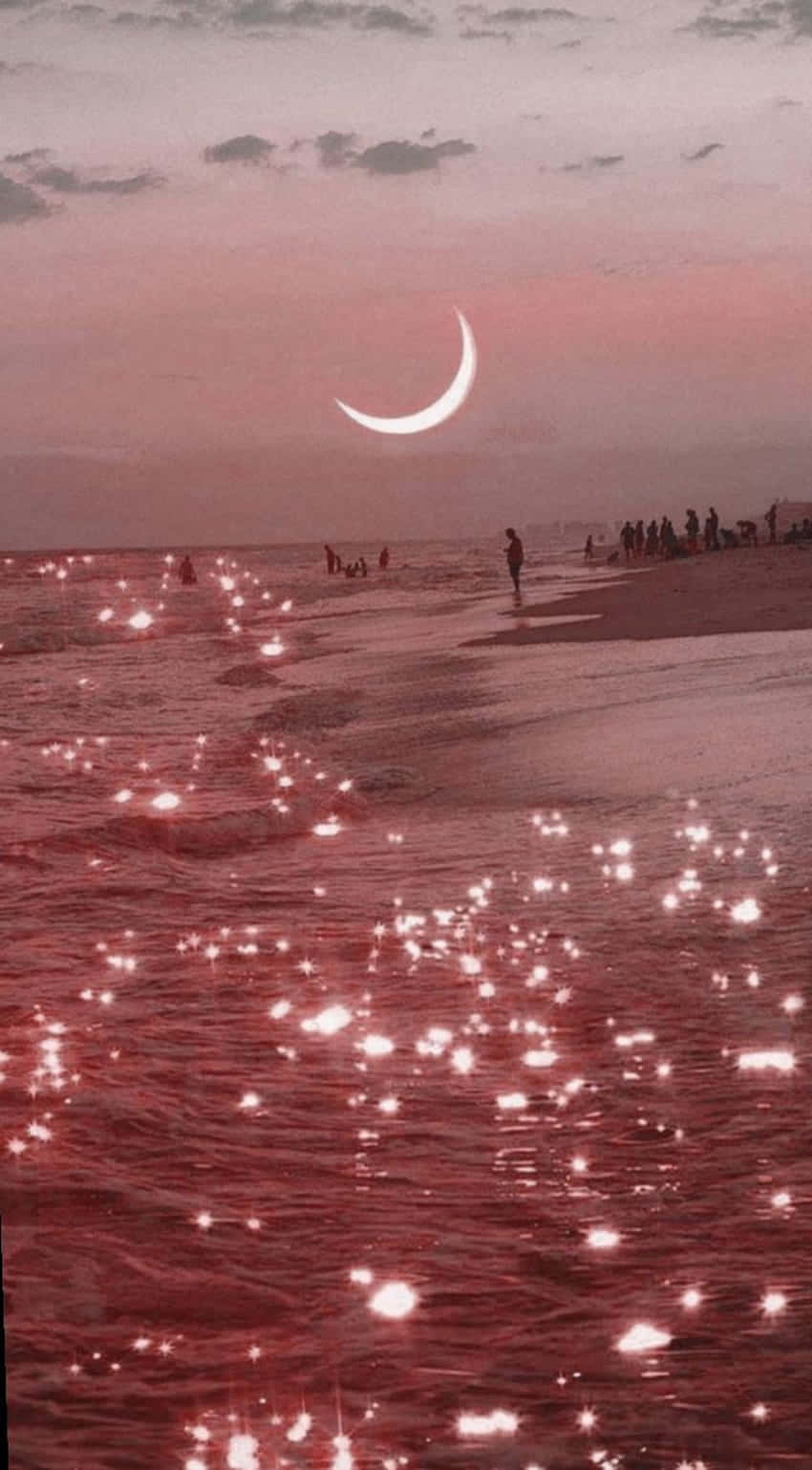 A Pink Moon And Stars On The Beach Background