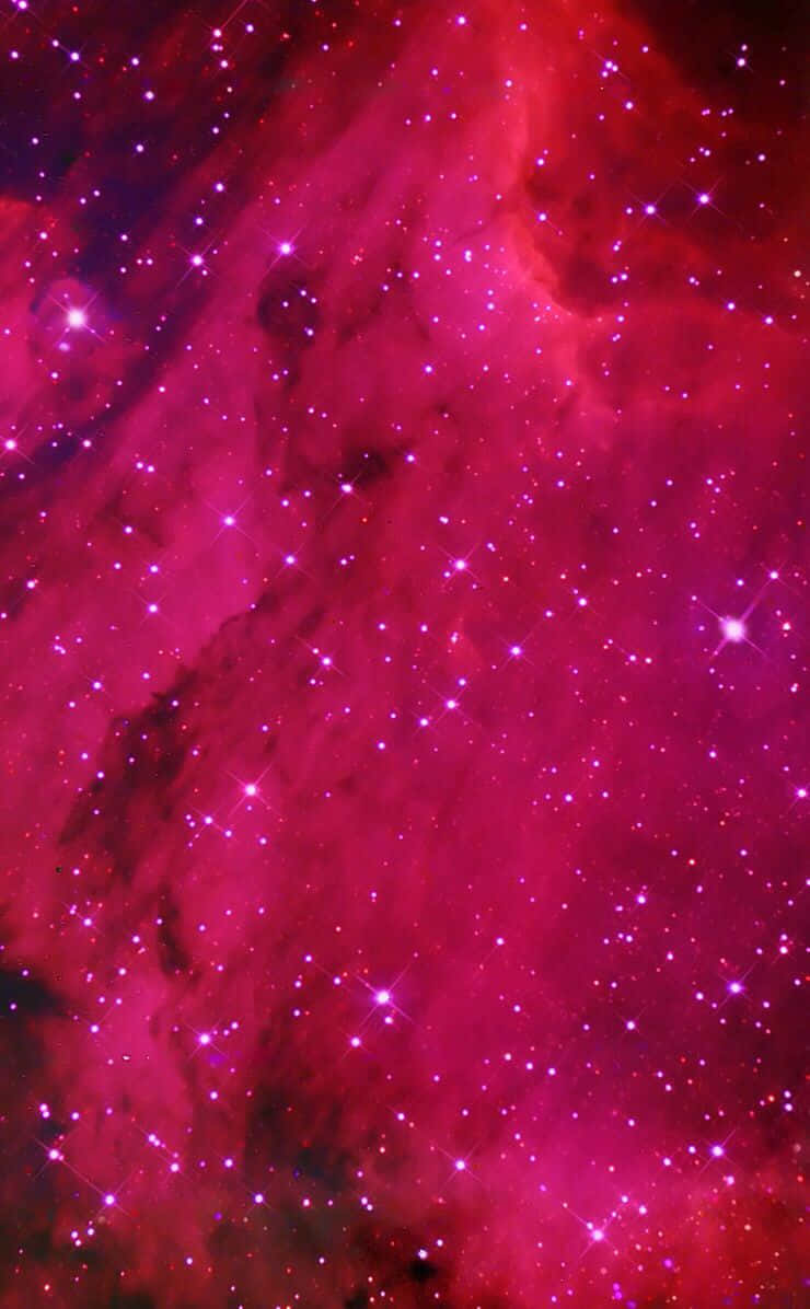 A Pink Nebula With Stars And Stars Background