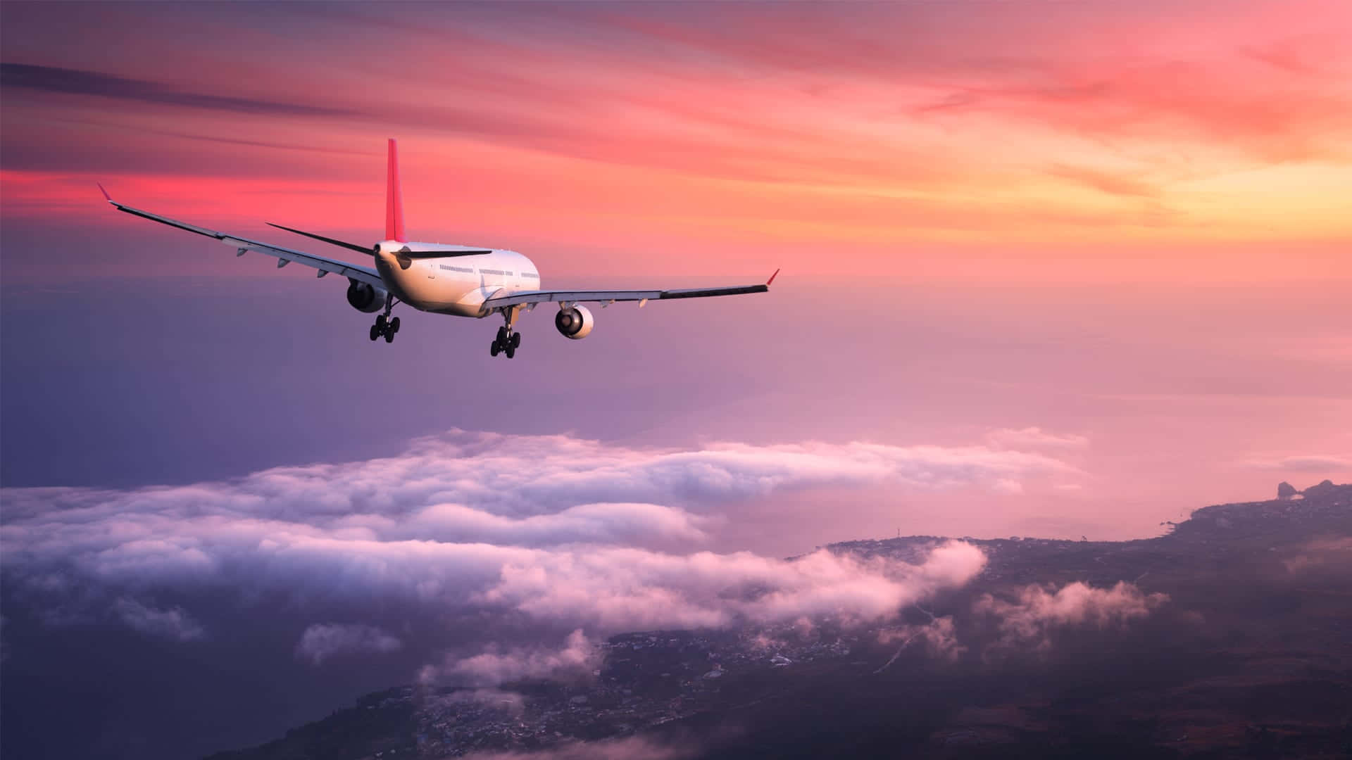 A Pink Passenger Plane Flying In The Sky Against A Backdrop Of Clouds Background