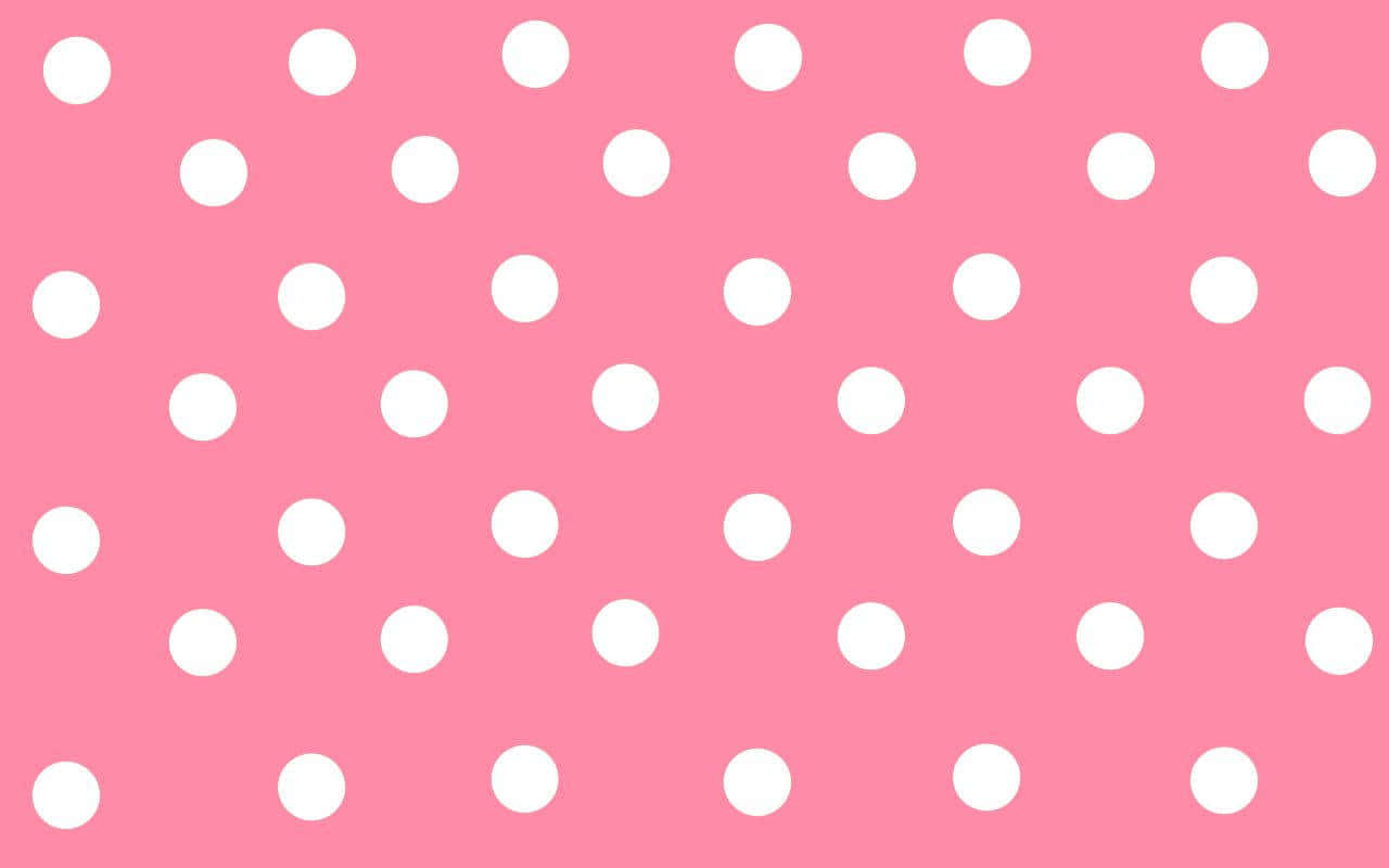 A Pink Polka Dot Pattern With White Dots Background