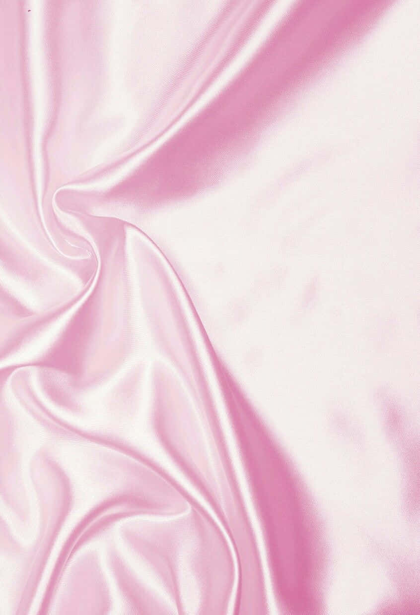 A Pink Satin Fabric With A Smooth Texture Background