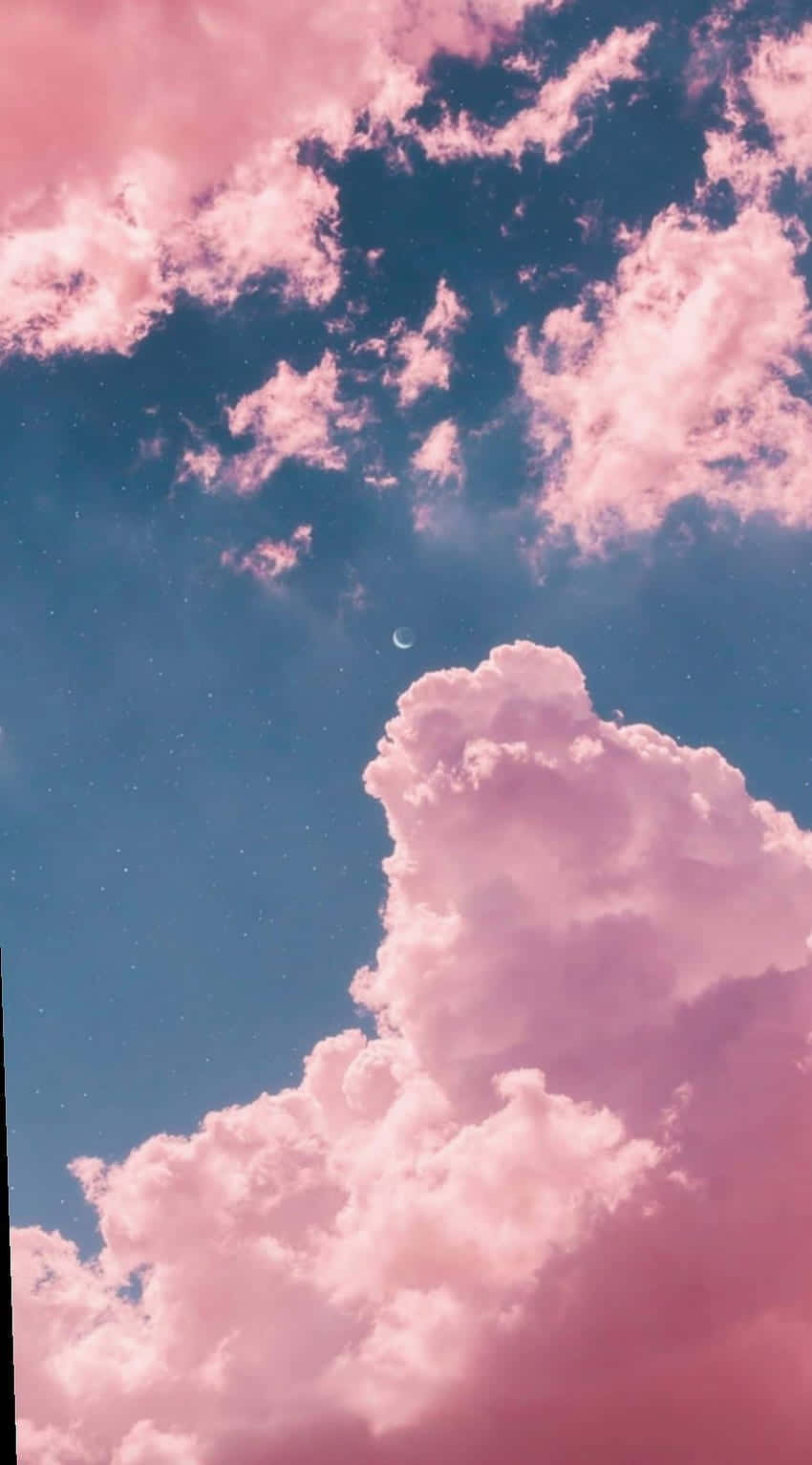 A Pink Sky With Clouds And A Clock Tower