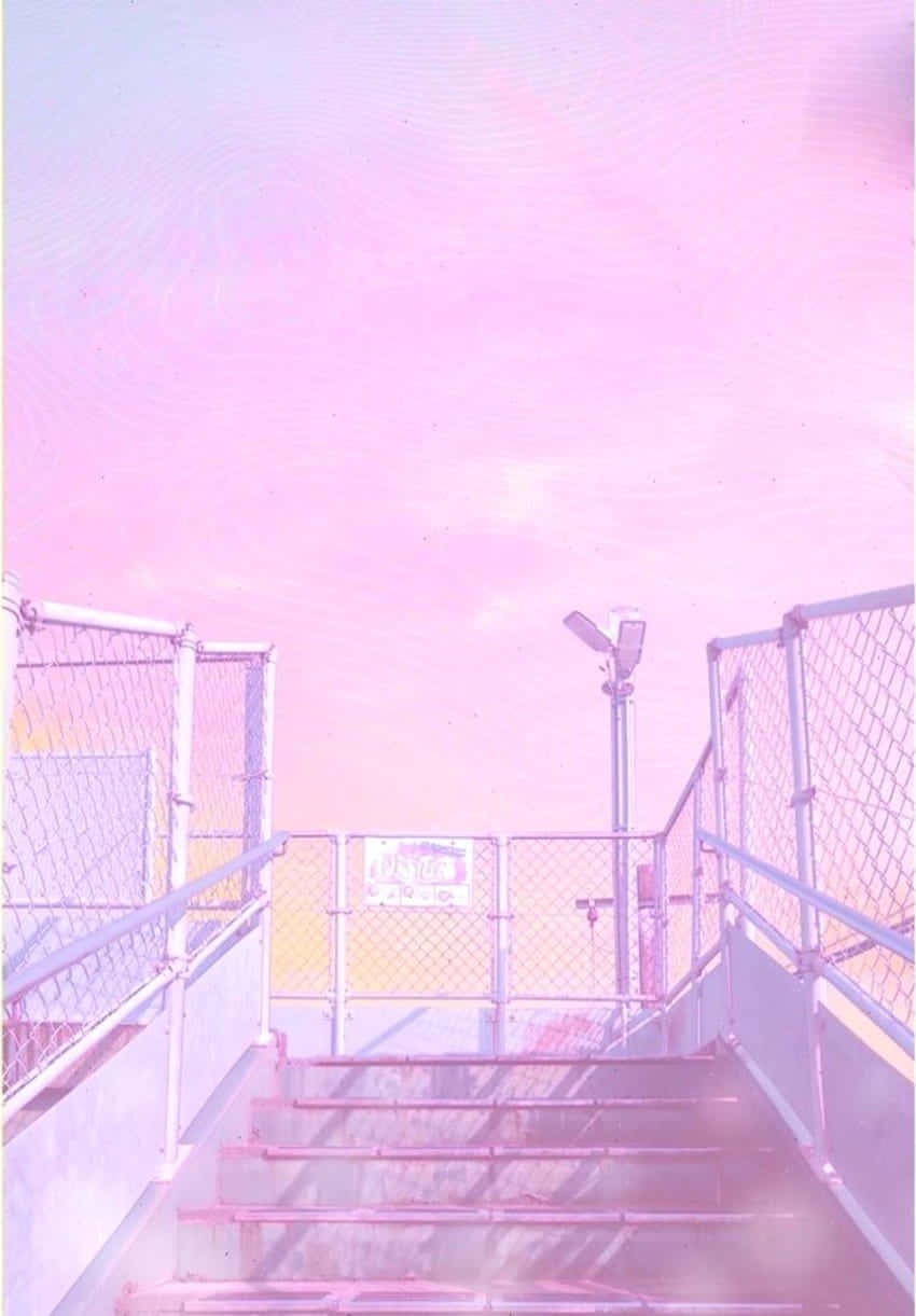 A Pink Sky With Stairs Leading Up To A Building Background