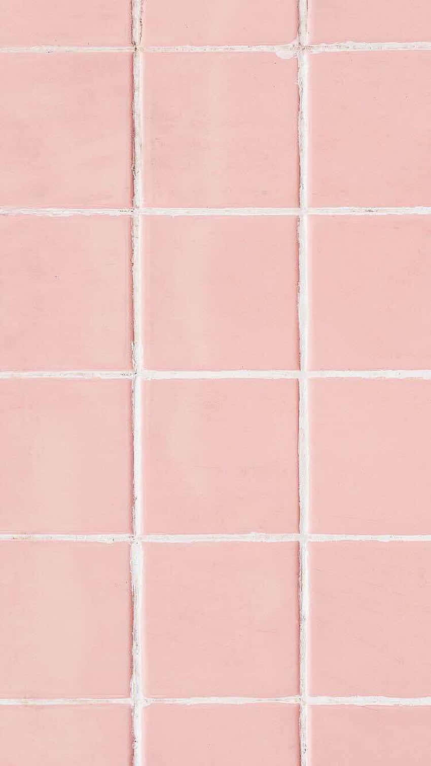 A Pink Tile With White Squares On It Background