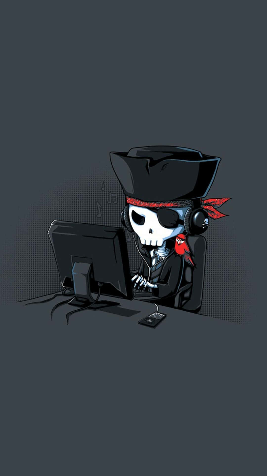 A Pirate Skull Sitting At A Computer Background