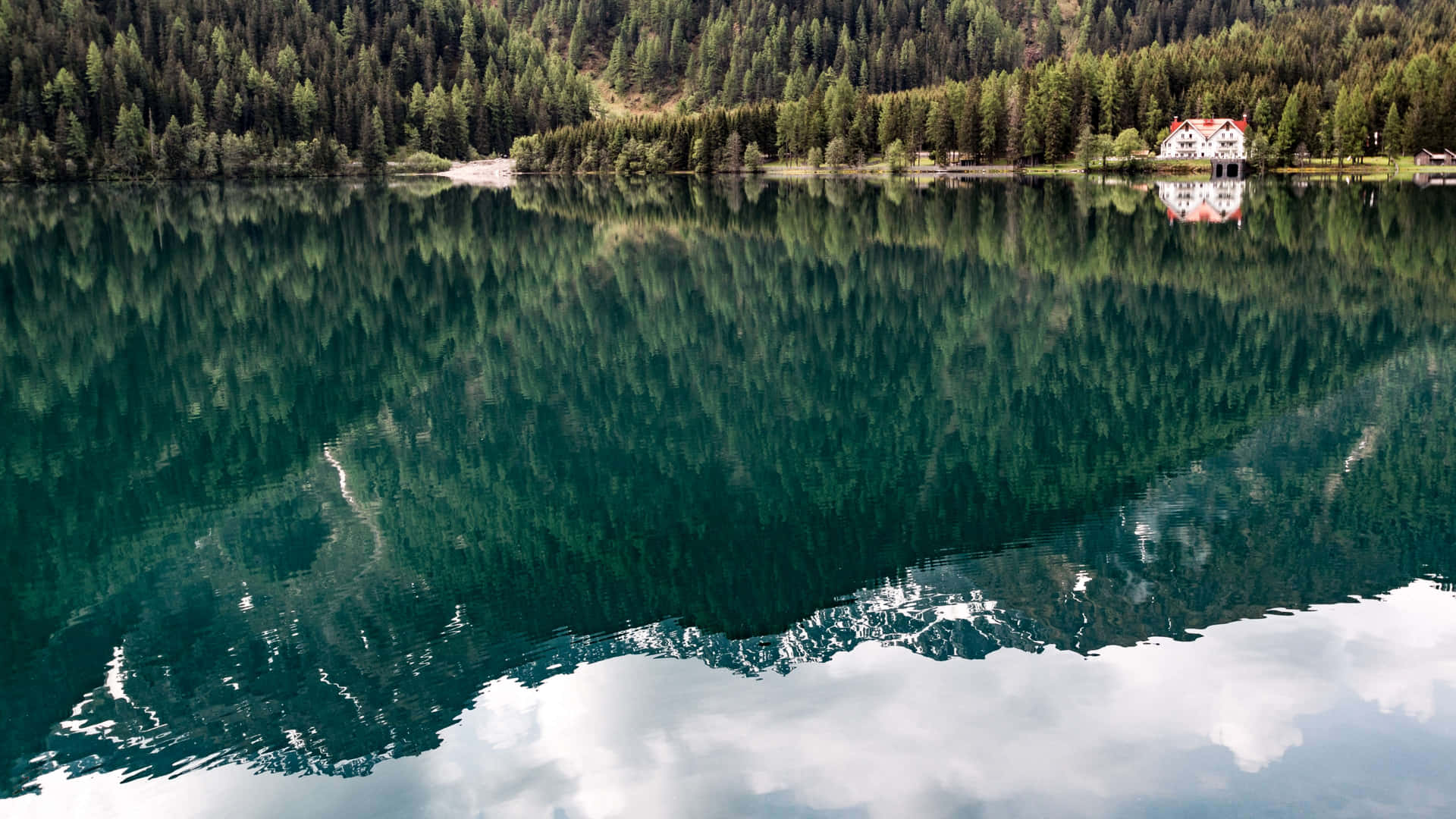 A Placid Lake In Antholzer See Background
