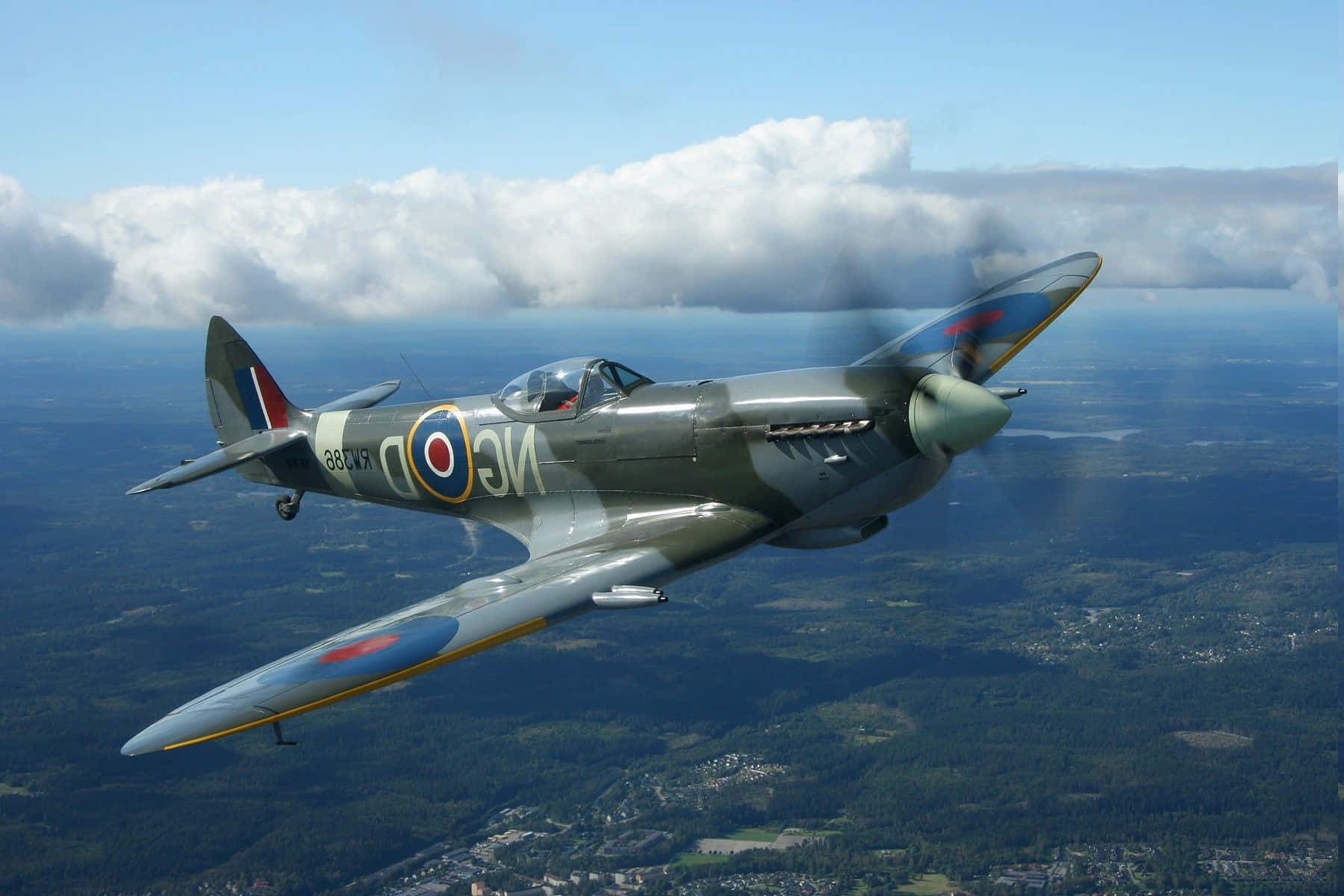 A Plane Flying In The Sky Background